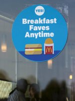 A McDonald's store displays a sign informing customers that they now serve breakfast all day long, at their location in Encinitas, California