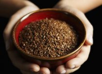 Hands holding bowl of flax seed - Influx Productions/The Image Bank/Getty Images