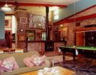 Lounge with fireplace and pool table
